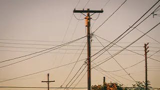 telephone poles and lines against a skyline
